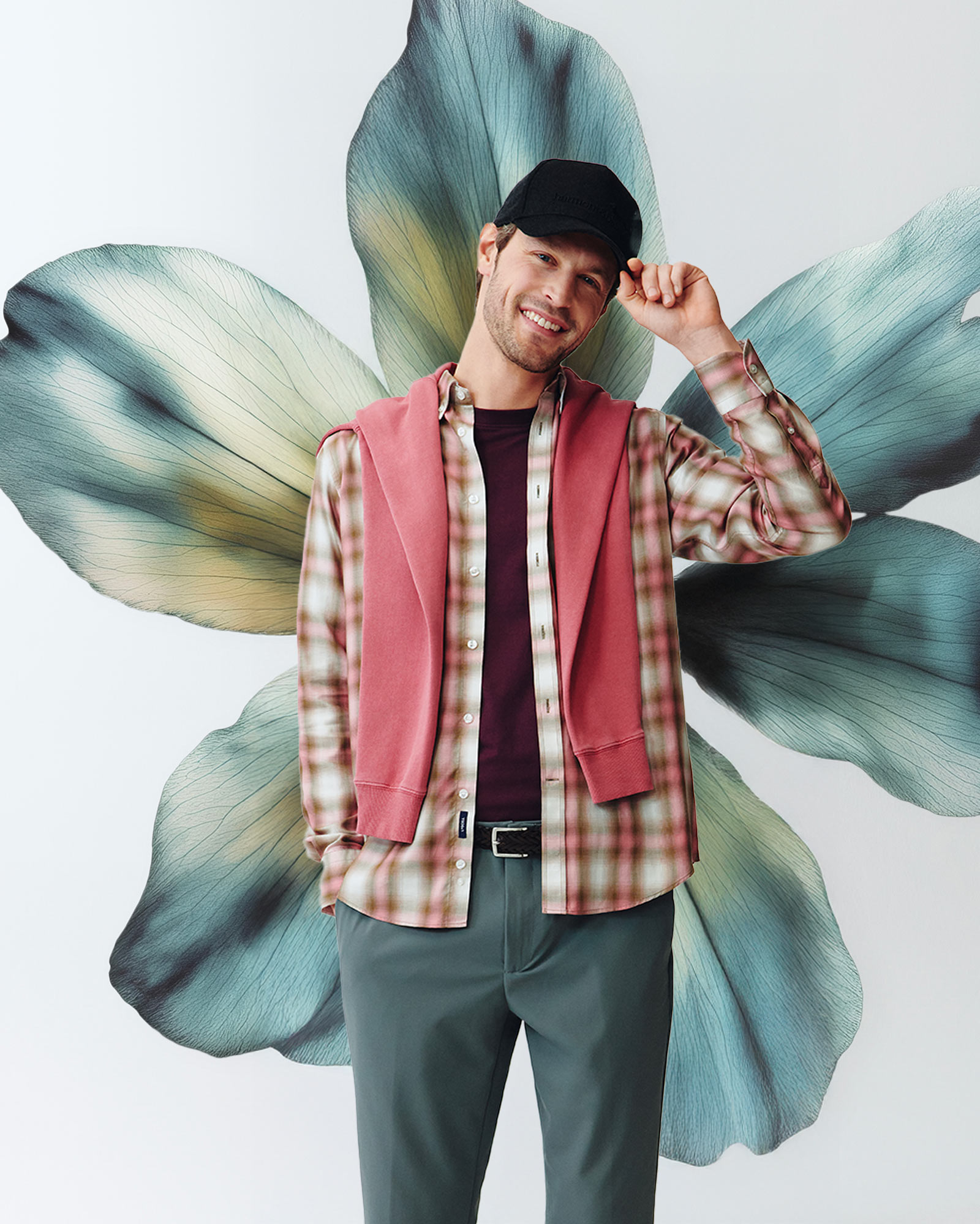 Checked shirt in foreground, graphic floral background.