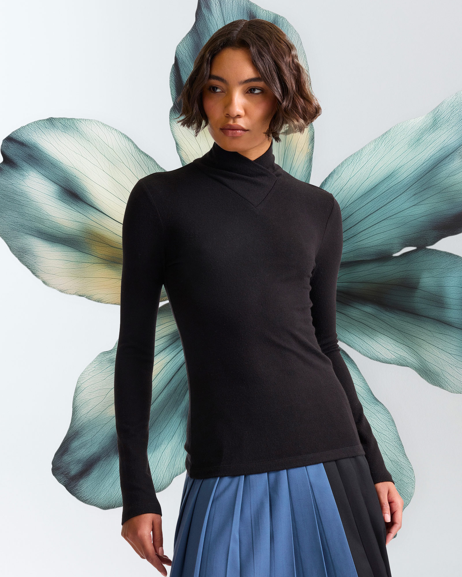 Woman wearing black long-sleeve turtleneck sweater