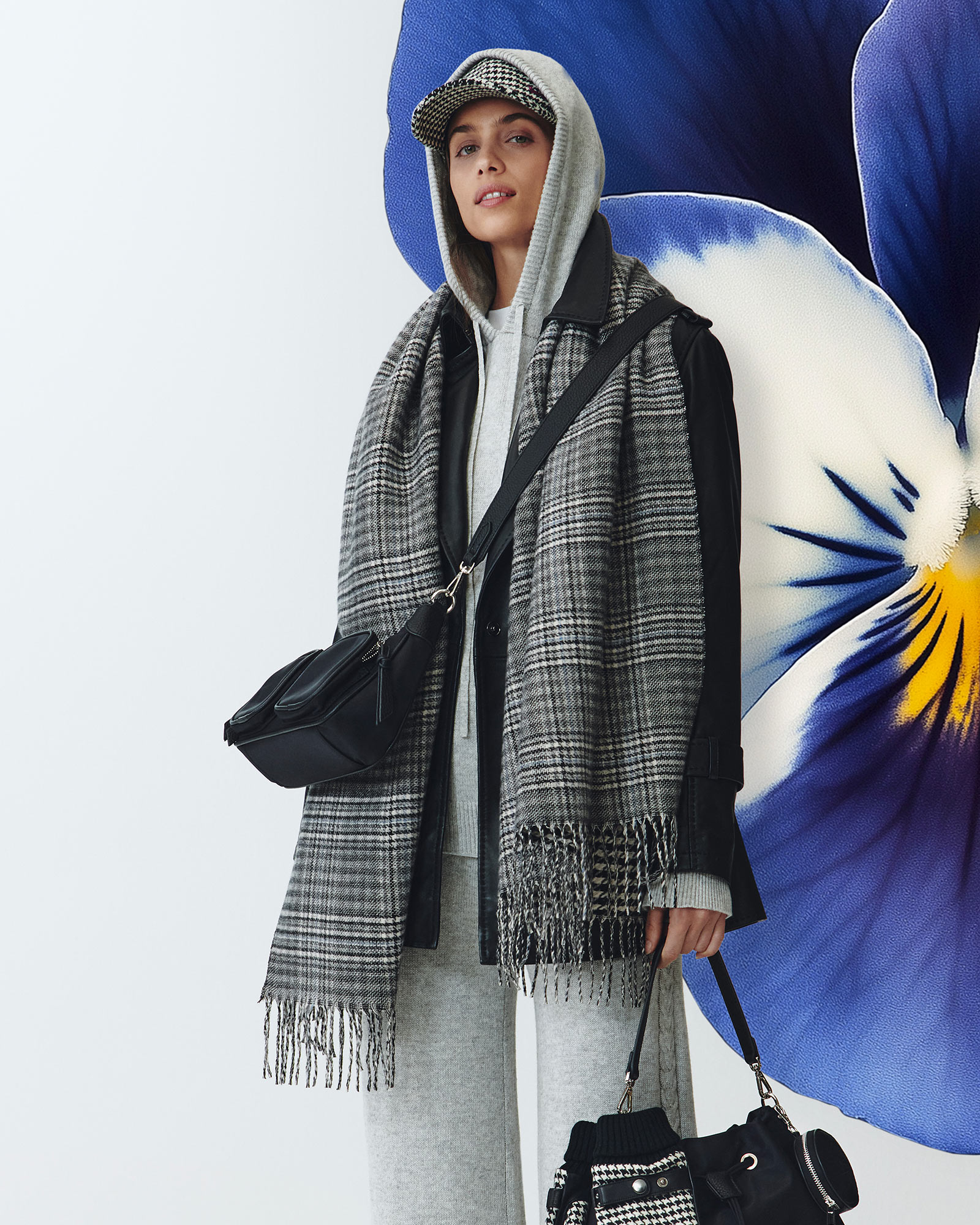 Long coat and check scarf, illustrated backdrop.