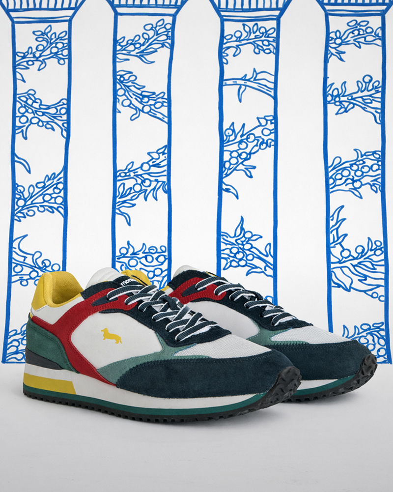 Uomo con giacca pied-de-poule e felpa con cappuccio verde salvia