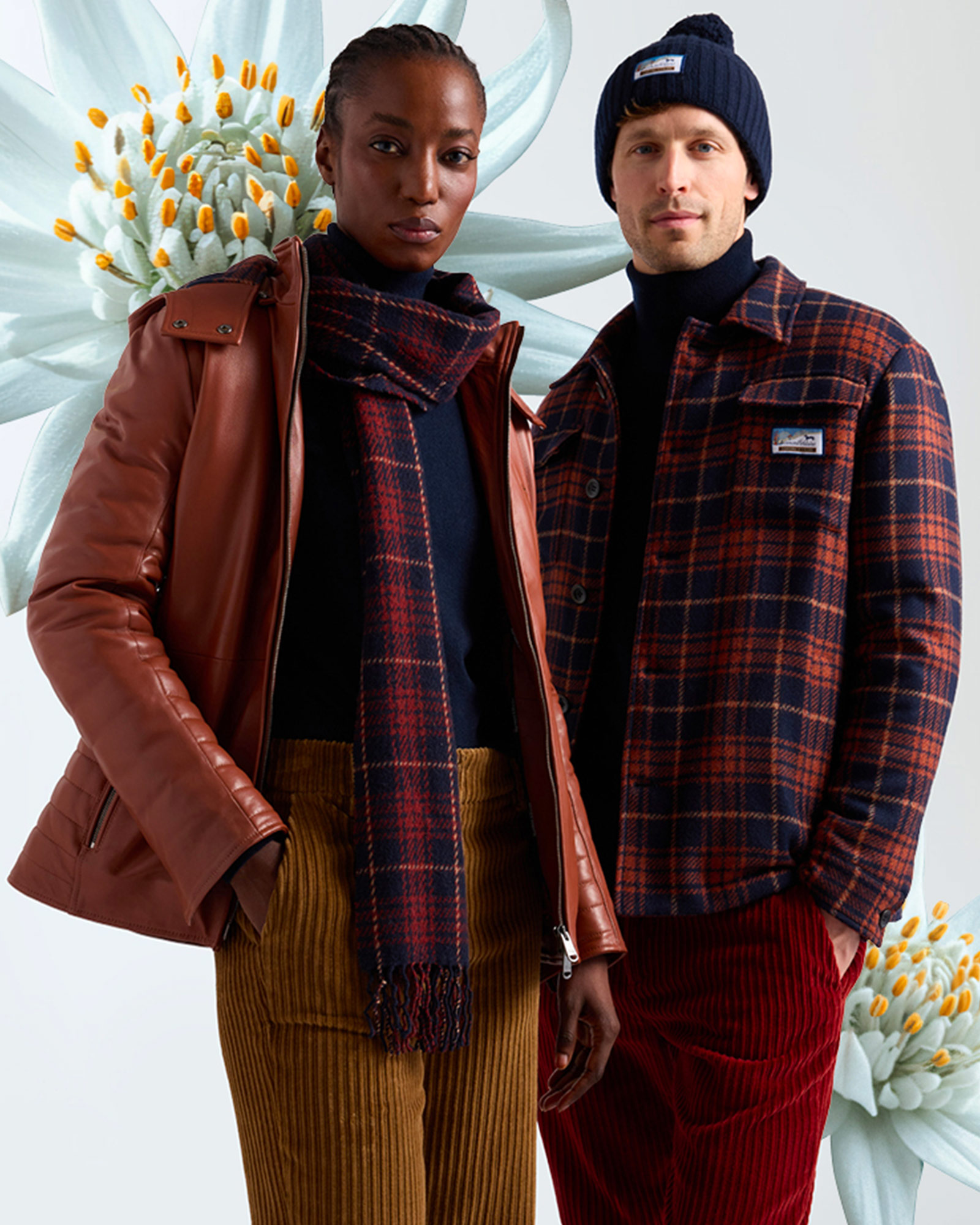 Woman in brown leather jacket with checked scarf next to man wearing blue and red checked overshirt.