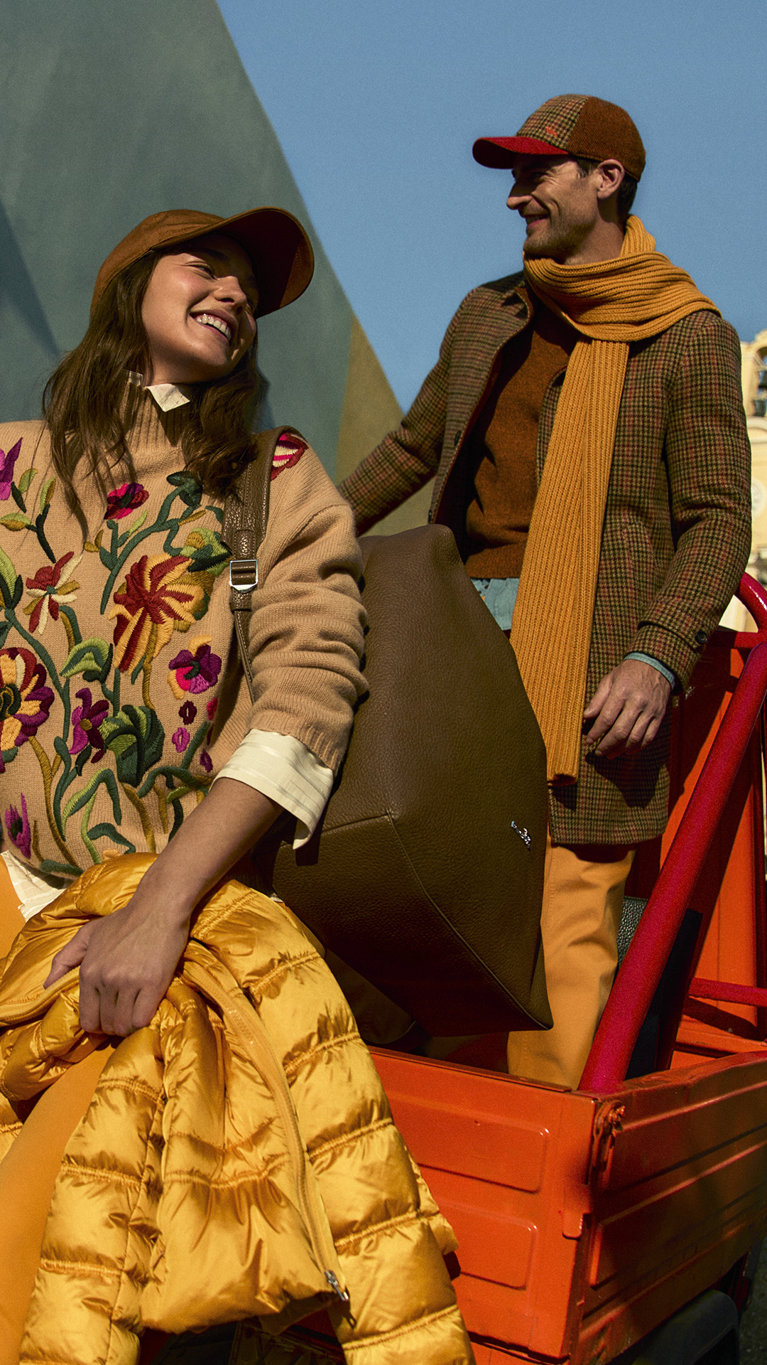Group of friends in colorful autumn outfits outdoors.