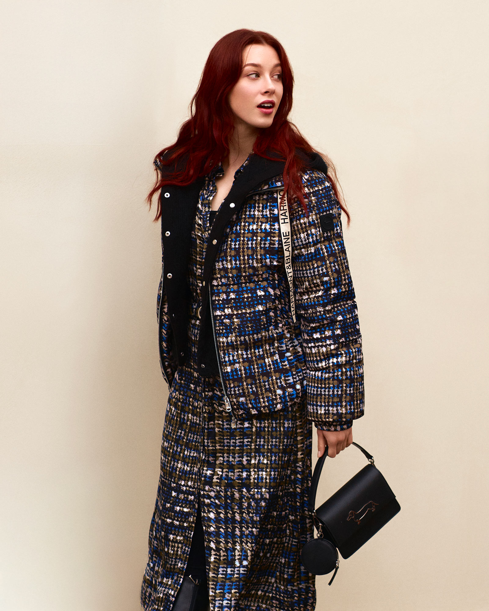 Long coat and check scarf, illustrated backdrop.