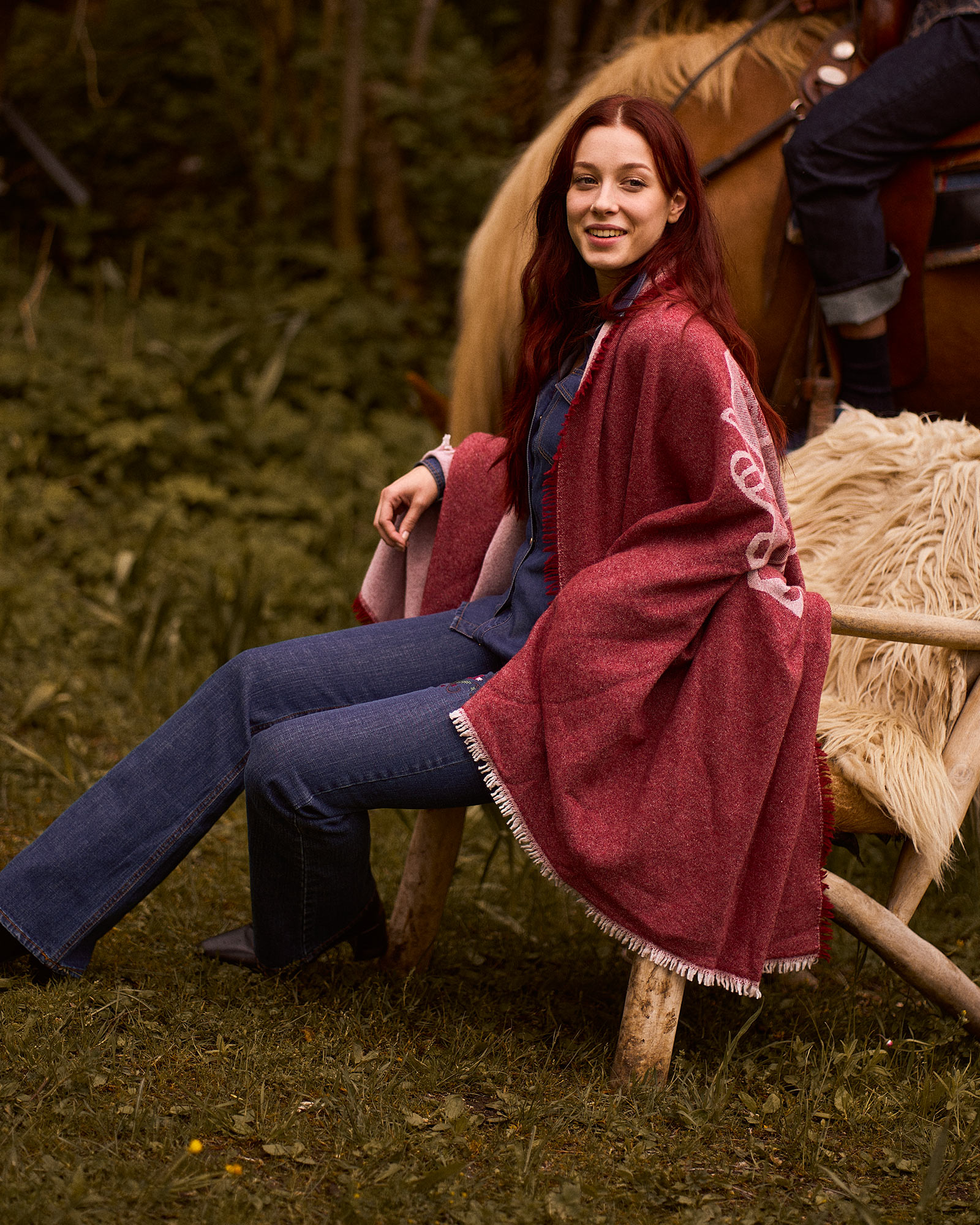 Person indoors wearing light trousers, neutral background