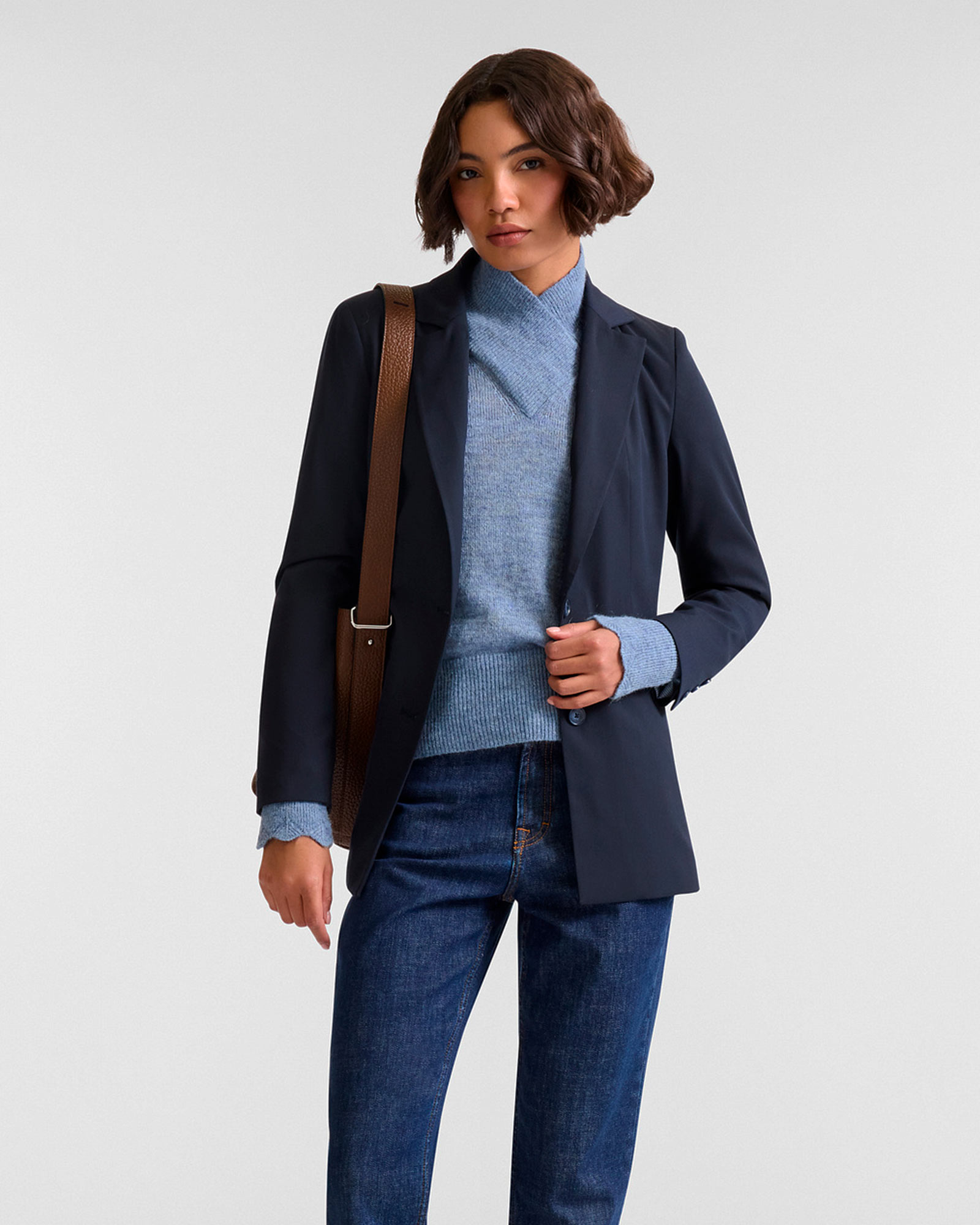 Woman in blue blazer and light blue sweater