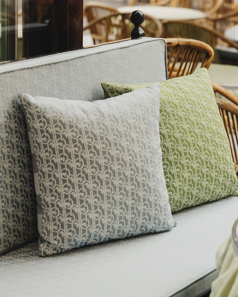 Green and grey decorative cushions at Harmont & Blaine bar in Capri.