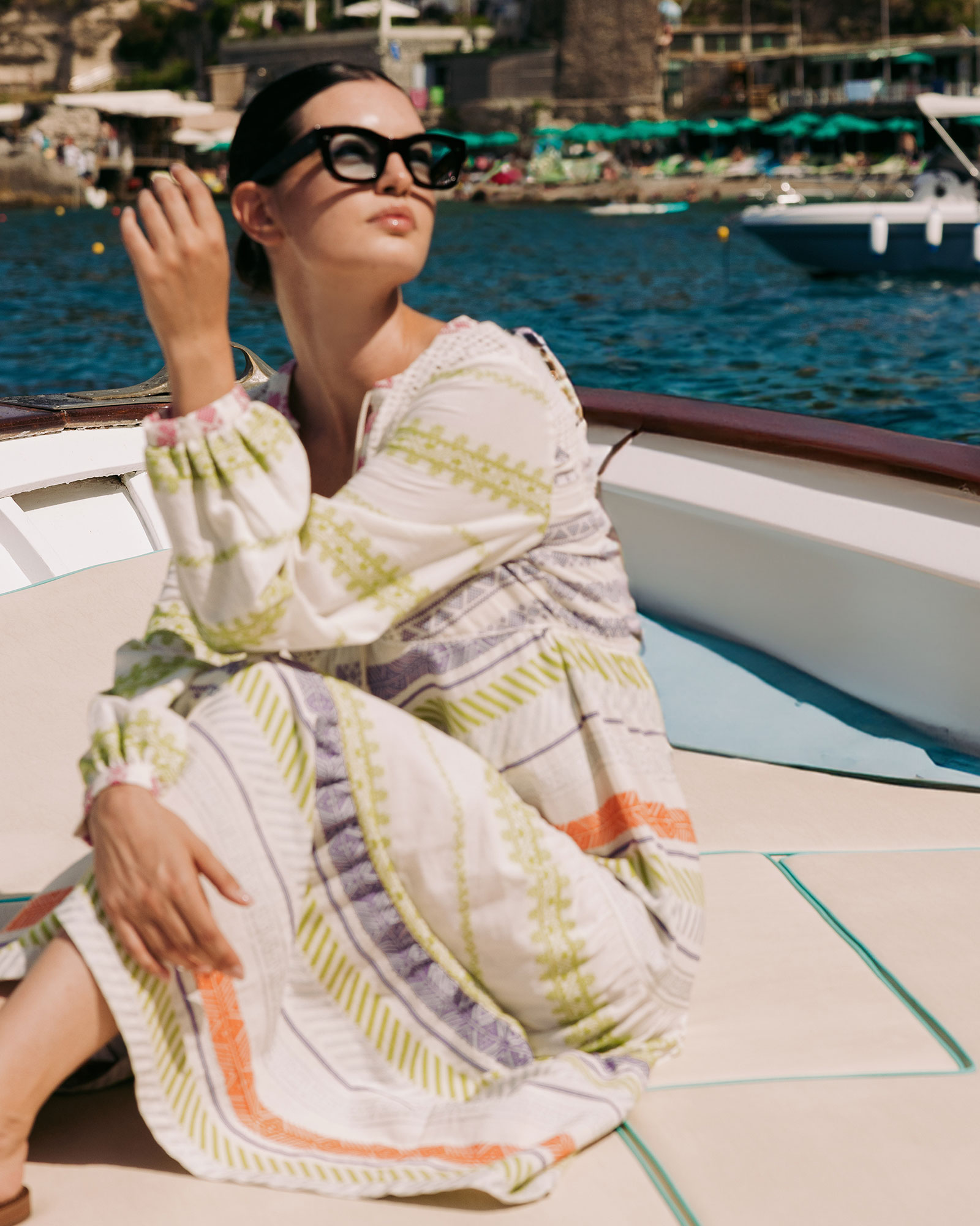 Woman in summer dress on a boat