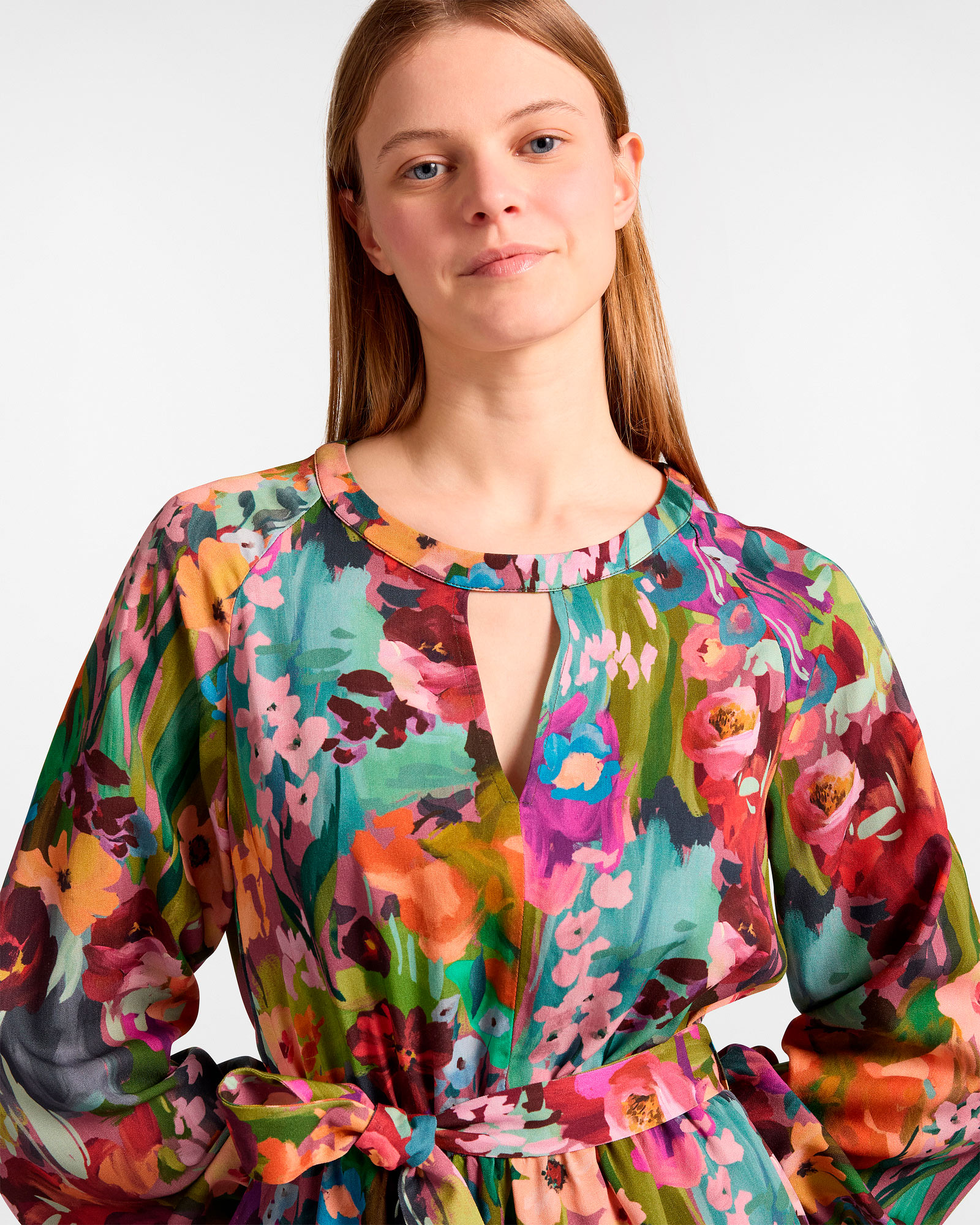 Woman in colorful floral dress