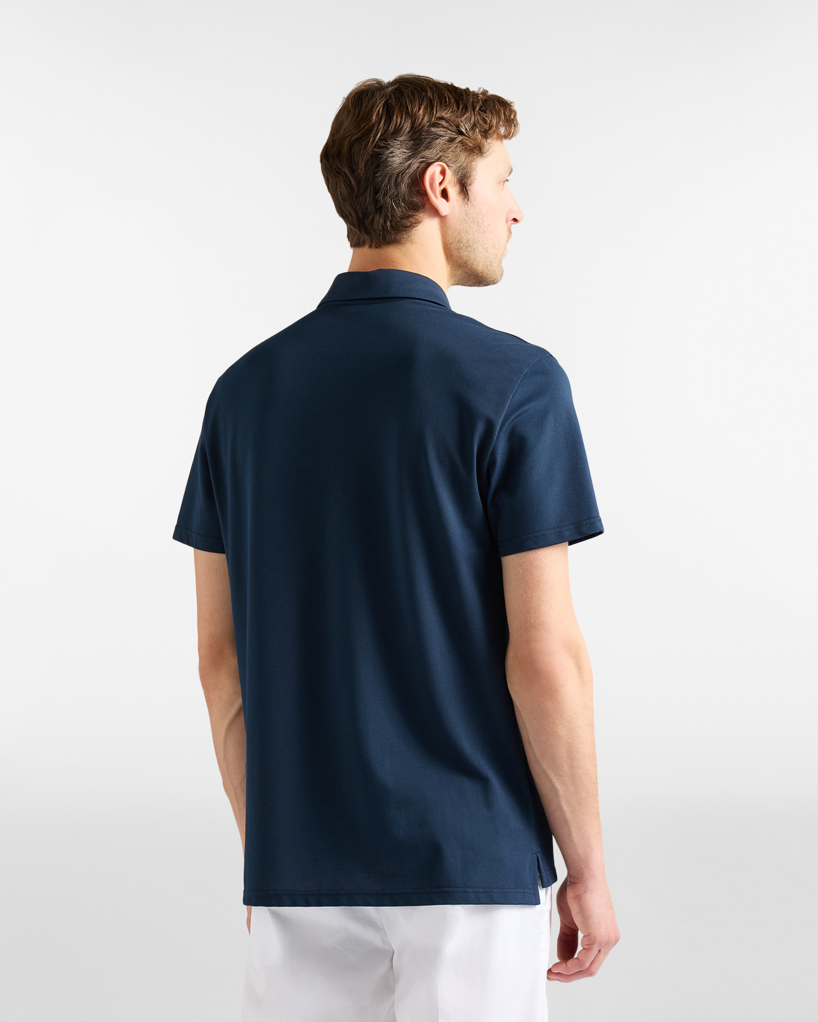 Men's polo shirt with snap buttons in technical piqu&eacute;