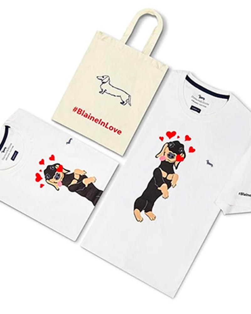 Harmont & Blaine celebrates the lovers’ day with the launch of a new limited-edition t-shirt designed in collaboration with Jay Lohmann. The tee’s customization is inspired by the Casual Conversations series, a new creative and expressive space that the brand has recently inaugurated by inviting the American artist to play with the iconic dachshund Blaine.